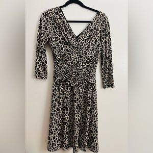 Knit dress dressbarn. Size 6 print cream/brown roused waist, v-neck and back.